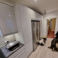 High-gloss kitchen cabinet installation in progress — Sydney
