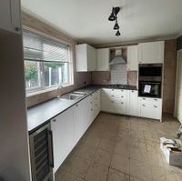 White shaker kitchen installation in progress — Sydney